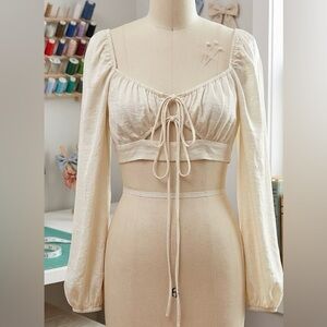 PrettyLittleThing Cream Long Sleeve Tie Front Crop Top